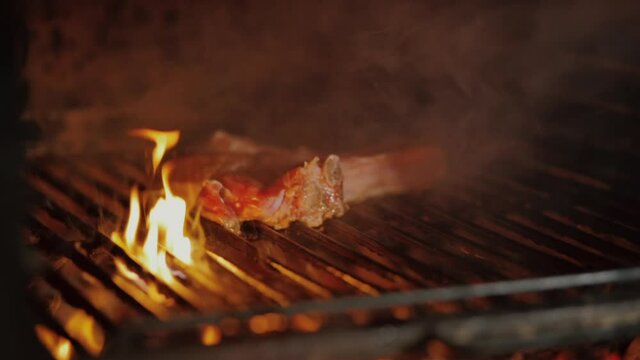 josper, burn the fire,Big flames in the barbecue with a steak, grilled veal ribs. High quality FullHD footage