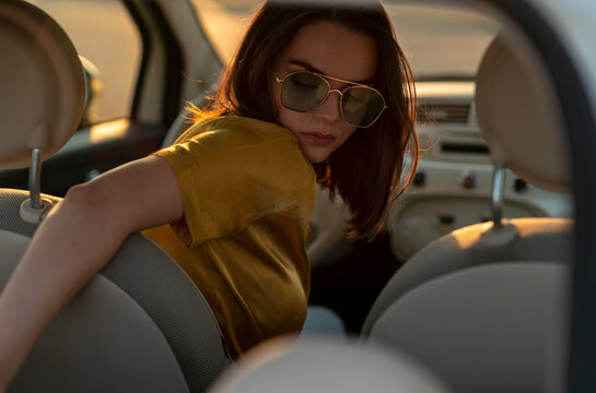A Woman driving a car