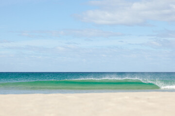 Wave breaking onto a beach. Peron dunes. East coast of Tasmania. Australia