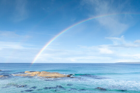 A rainbow over the Bay of Fires. Tasmania. Australia.