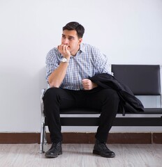 Man nervously impatiently waiting in the lobby