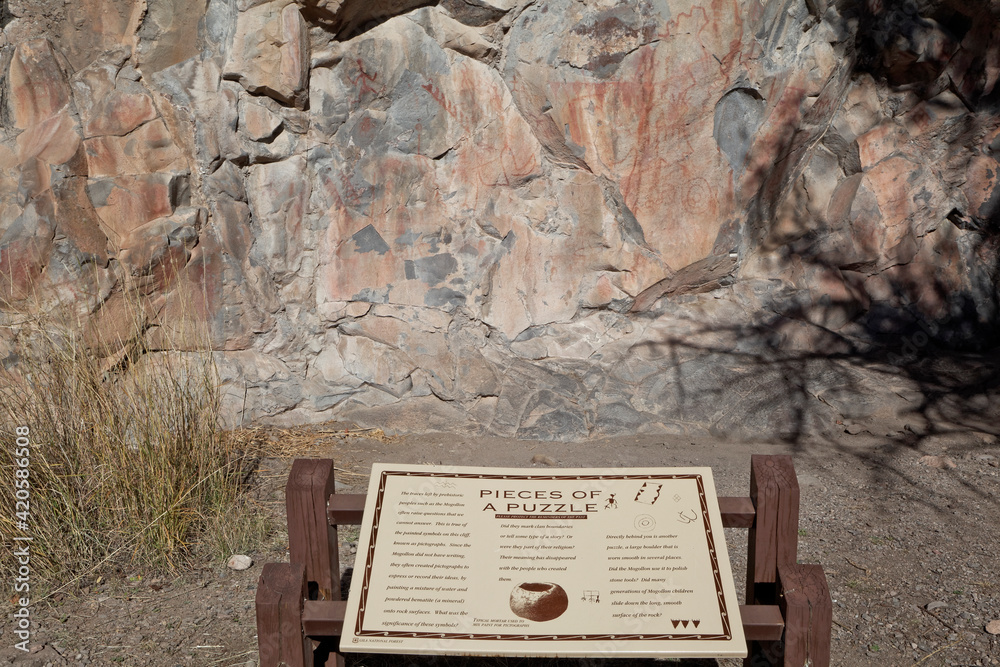 Canvas Prints usa, new mexico, gila cliff dwellings national monument. pictograph paintings on rock and tourist in