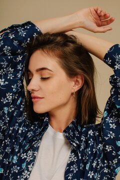 Trendy brunette model with nose piercing