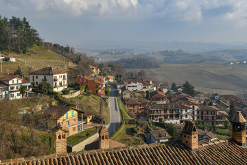 Fototapeta na wymiar Elevated view of the old village of Monforte d'Alba, in the Langhe vineyard hills, Unesco World Heritage Site, in winter, Cuneo province, Piedmont, Italy