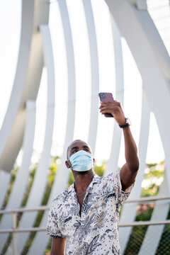 Stylish Man With Medical Mask Taking a Selfie.