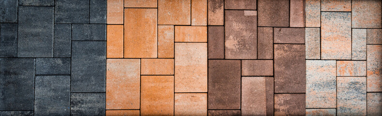 Stones in different colors and materials stacked into wall and usable as background for architecture, building materials