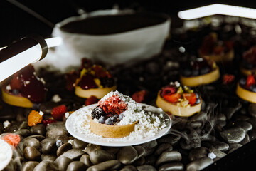 modern sweet dessert with frozen ingredients and fruits 