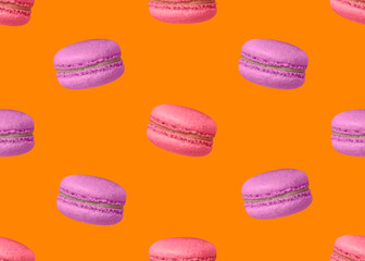 Pink and purple macaroons on orange background