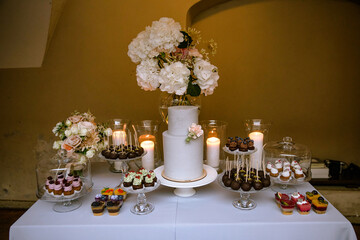 the beautiful bride and groom wedding cake on the table