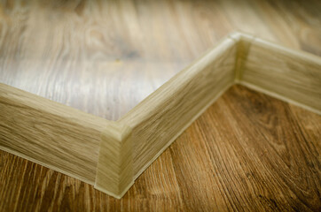 Floor skirting boards. Under the tree.