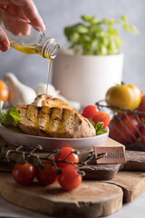 Homemade Italian Bruschetta Appetizer with Basil,Tomatoes , parmesan and olivien
Mediterranean Kitchen