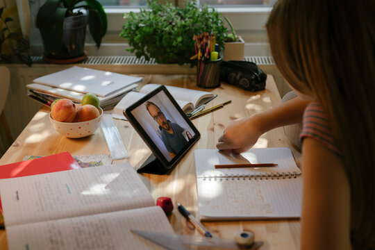 Teen Girl Watches Virtual Class From Home