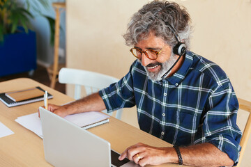 Helpful man attending customers by call phone