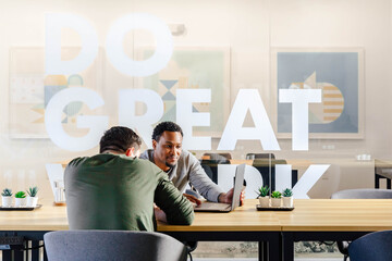 Two Men at the Office with a Computer