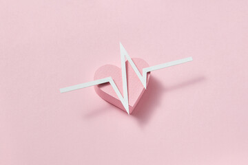 Graphic line of ekg on a papercraft heart.