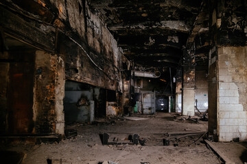 Burnt and ruined interior of industrial building after fire. Consequences of war, fire or other disaster