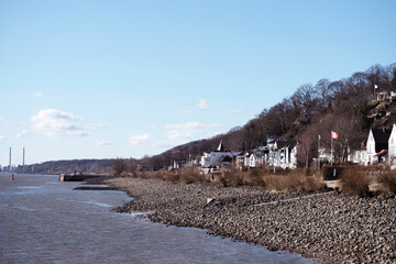 View of the Elbe at low tide and the terraced area of Hamburg Blankenese in early spring