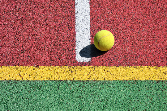 Tennis ball on the court close up