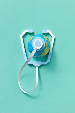 Handmade papercraft stethoscope and Earth's globe.