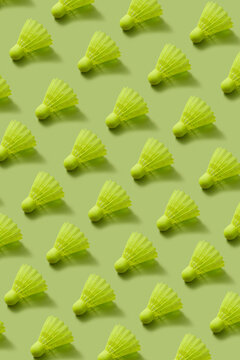 Pattern from plastic shuttlecocks of lemon color.