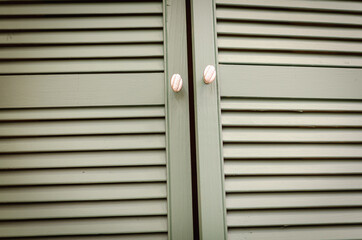 Wooden doors with cabinet handles.