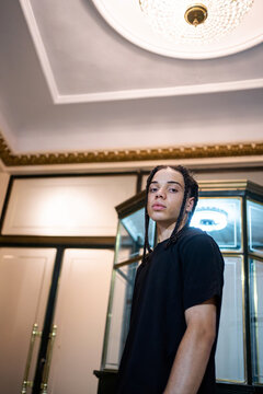 Young Boy In The City At Night.