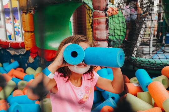 Girl being silly in bouncy house.