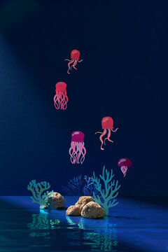 Underwater world sea life with transparent colorful jellyfish with coral