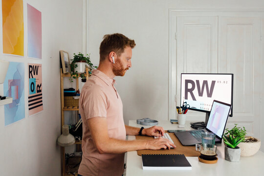 Man Typing On His Computer