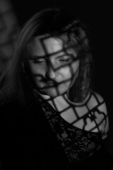 black and white portrait of an overweight woman. Art photography with unusual shadows