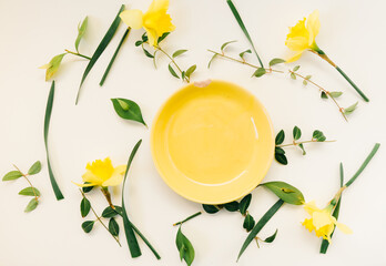 Creative spring concept ideas  made of fresh  yellow  flowers and pastel plate bowl  decoration isolated on white background .Flat lay - 420595726