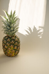 Pineapple, a Ripe, Fresh Fruit Food, Whole, Isolated on White summer sun light with shadow ,  side view - 420596541