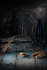 Vintage jewelry box and glass bottles on rustic table