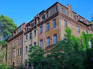 Fototapeta na wymiar old apartment buildings with dormer windows and mansard roof