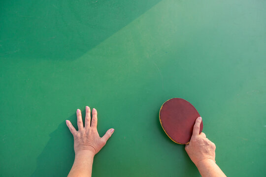Anonimous Hands Holding Ping Pong Racket And a Ball