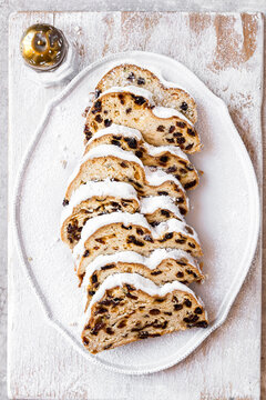 Stollen Christmas loaf with dried fruit and powered sugar