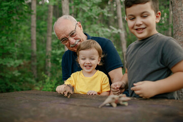 Grandfather spending day with his grandchildren