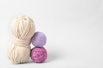 Soft colorful woolen yarns on white background
