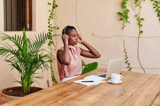 Young Woman Working Online Outside At Home