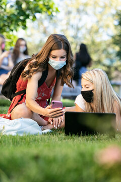 Covid: Friends With Face Masks Studying Remotely Outdoors