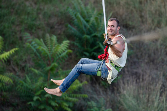 Man having fun while highline slacklining