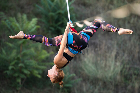 Woman dancing on slackline highline