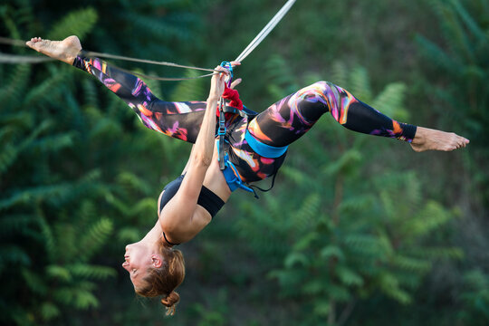 Woman dancing on slackline highline