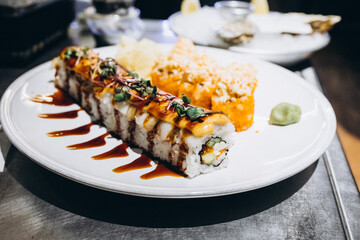 sushi on a plate, a dish in a restaurant