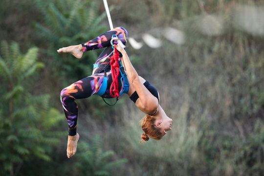 Woman dancing on slackline highline