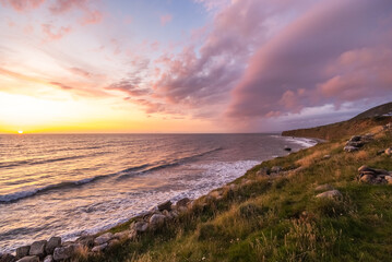 amazing sunset over the sea, coast of wales, england 
