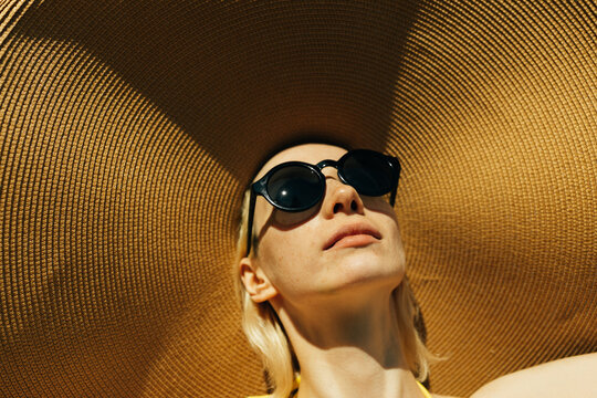 woman with large straw hat
