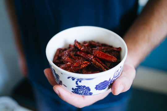 Sundried tomatoes in white bowl with pattern