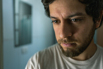 indoor portrait of a worried man