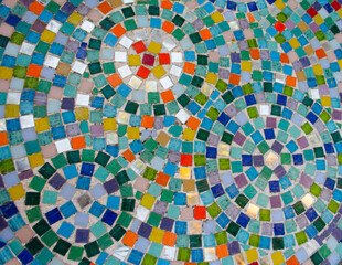Beautiful pattern of square Venetian mosaics forming circles.